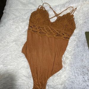 Brown body suit with padding